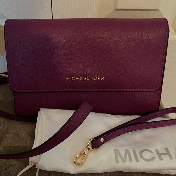 Michael Kors Handbags - NWT Michael Kors 3 in 1 Travel Clutch/Crossbody/Wristlet in Pomegranate.